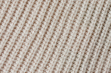 knitted texture of beige yarn