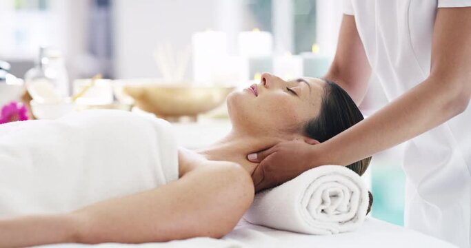 Spa, head massage and a woman on a table with hands of a therapist for physical therapy, health and wellness. Female client relax at a resort for self care, zen skincare and luxury service for beauty