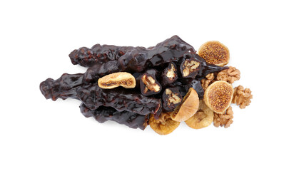 Obraz premium Delicious sweet churchkhelas with walnuts and dried figs isolated on white, top view