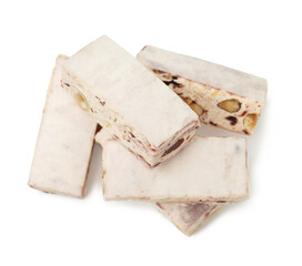 Many pieces of delicious nougat on white background, top view