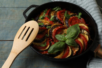 Delicious ratatouille on light blue wooden table, closeup