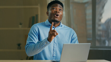 Obraz premium Creative African American ethnic 30s man businessman office employee writer manager worker entrepreneur designer think business plan come up with idea find solution answer brainstorming work on laptop