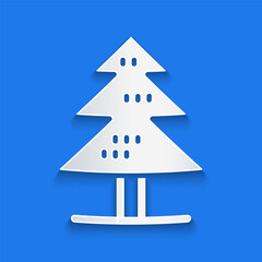 Paper cut Tree icon isolated on blue background. Forest symbol. Paper art style. Vector