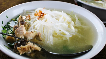 Central Javanese chicken soup with a delicious savory sauce topped with fried onions