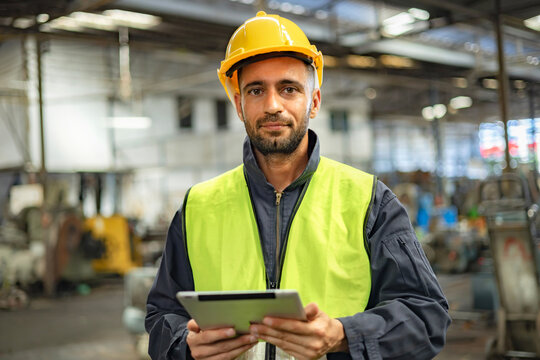 engineer worker using digital tablet with looking at camera
