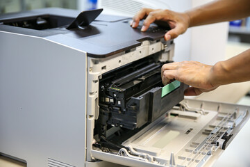 Technician hand open cover printer photocopier or photocopy to replace ink cartridges or fix paper...