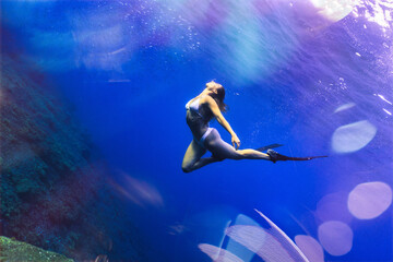 Fototapeta na wymiar underwater girl in a spectacular place