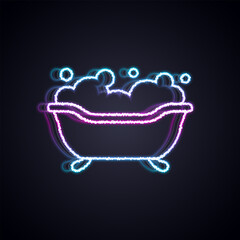 Glowing neon line Bathtub with foam bubbles inside icon isolated on black background. Vector