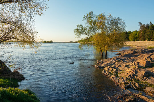 Granite rock on the bank of the Dnieper (Dnipro) river near the embankment in Kremenchuk city, Ukraine