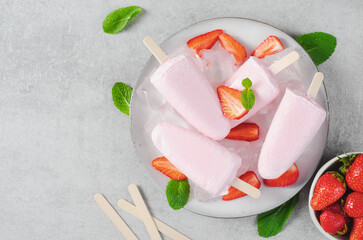 Refreshing Strawberry Popsicles, Ice Lolly with Fresh Strawberry and Mint on Bright Background