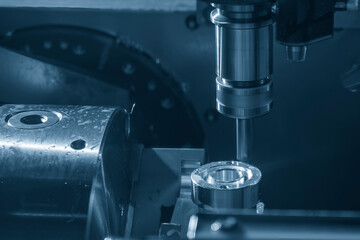 The CNC milling machine slot cutting the automotive parts by flat end mill tools.