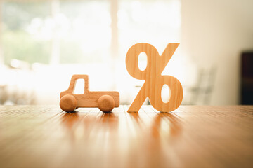 Wooden car model, Percentage symbol with sunlight, Concepts of interest, a symbol for buying a new car, vehicle car auto repair service maintenance.	
