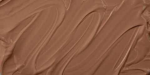 The base of the foundation is smeared as a sample background close-up. Makeup cosmetics. Concealer. Concealer texture.