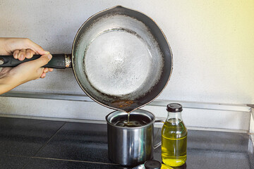 Pour the used cooking oil into the contaminated cooking oil container. Old or used cooking oil can...