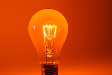 Glowing light bulb on orange background Generative AI