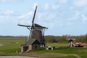 Fototapeta na wymiar Moulin, Réserve naturelle, Mer des Wadden, île de la Frise, Ile Texel, Pays Bas