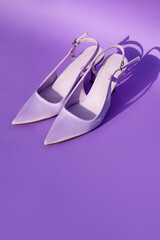 violet shoes of fashionable color on a violet background. Fashion shoes in Very Peri colors. Purple accessories. place for text