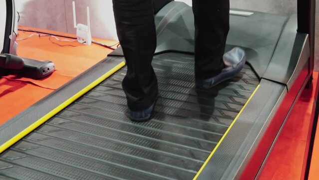 people walking on a treadmill. Cardio training for healthy physical, weight loss in the gym. Indoor workout lifestyle.