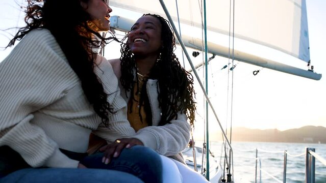 Happy young gay lesbian couple sailing San Francisco
