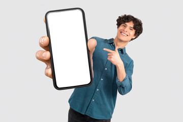 Guy Showing Giant Phone Blank Screen Advertising App, White Background