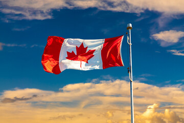 Canadian flag against blue sky