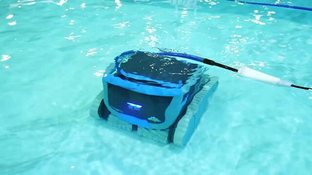 robot pool cleaner. Pool maintenance with automatic robot. Summer pool cleaning robot before swimming. cleaner the bottom of the pool and walls with a submersible robot.
