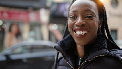 African american woman smiling confident standing at street