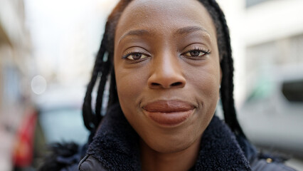 African american woman smiling confident standing at street