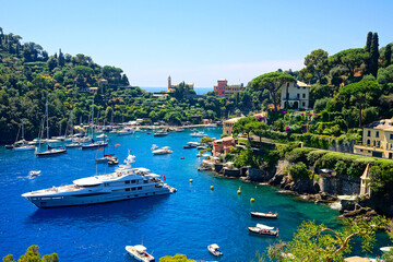 Portofino, Italy. Beautiful bay with boats in the Mediterranean Sea. - obrazy, fototapety, plakaty