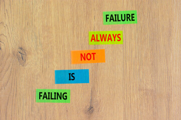 Failure or failing symbol. Concept words Failing is not always failure on colored paper. Beautiful wooden table wooden background. Business, failure or failing concept. Copy space.
