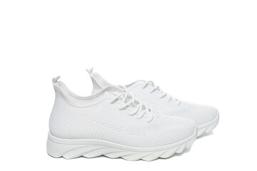 Summer white casual sneakers made of mesh fabric, on a white background, isolated