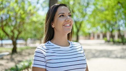 Middle eastern woman smiling confident looking up at park