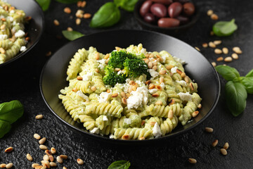 Creamy broccoli feta cheese pasta with pine nuts. Healthy food