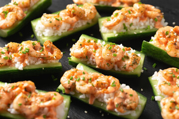 Cucumber Shrimp Sushi Boats with Spicy Mayo, Rice, Chives and sesame seeds