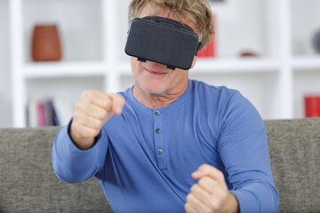 mature business man wearing virtual reality googles