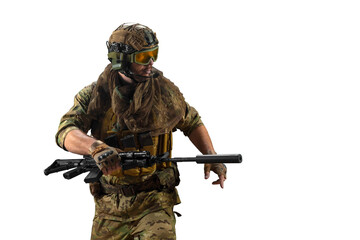 Special forces fighter, during a special operation walks with an automatic rifle looking to the...