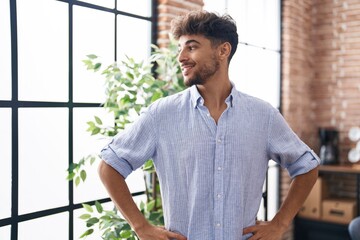 Fototapeta premium Young arab man business worker smiling confident at office