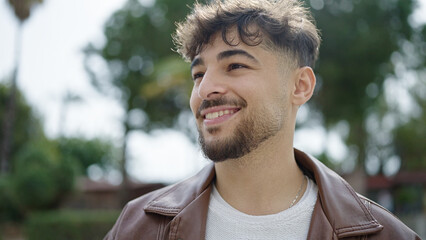 Young arab man smiling confident standing at park