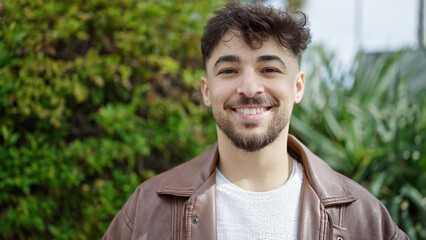 Young arab man smiling confident standing at park
