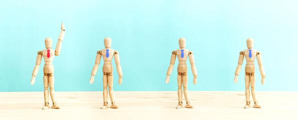 Obraz premium Wooden figures with ties, idea of leadership, recruitment of personnel and hr