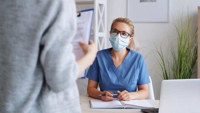 Medical Consultation. Doctor Office. Body Check. Female In Protective Mask Examining Patient In Clinic Disease Diagnostic Health Care.