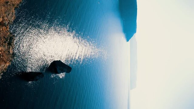 Beautiful seascape. Blue sea or ocean with rocks on a sunny day. 4K