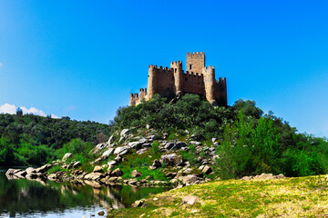 Fototapeta na wymiar View of Castle Reflected in Water. Almourol Castle (Castelo de Almourol)
