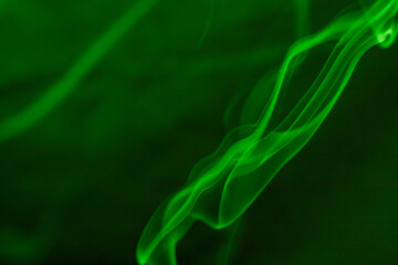 Green smoke curls beautifully in the air