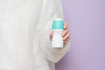 Body deodorant roll on in hand of physician medicine doctor