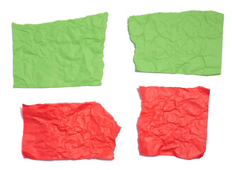 Green and red torn pieces of paper on a white isolated background