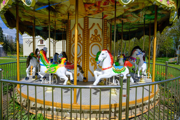 Pakruojis, Lithuania - 5 May 2023: A very old amusement carousel. Interior element of the manor territory