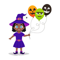 Cute girl in a witch costume with balloons