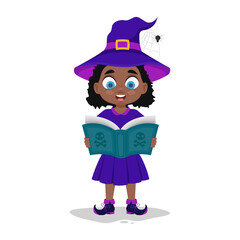 Cute child in witch costume reading a book