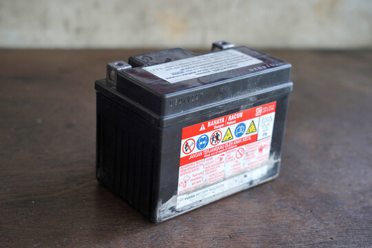 Tangerang, Indonesia - December 8, 2022 - ACCU battery for vehicles, used damaged accu battery. Selective focus